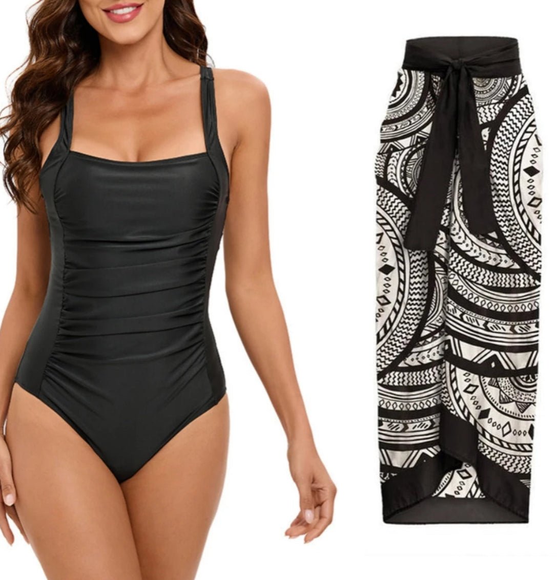 Conjunto de Enteriza Negra Lisa y Falda Pareo Estampada Ref. 0561 - Marea Bella Swimwear