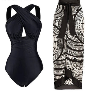 Conjunto de Enteriza Negra Lisa y Falda Pareo Estampada Ref. 0561 - Marea Bella Swimwear