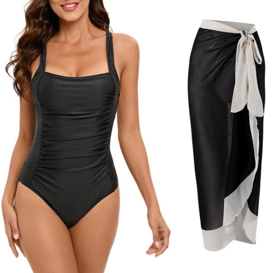 Conjunto de Enteriza Negra Lisa y Falda Pareo Estampada Ref. 0561 - Marea Bella Swimwear
